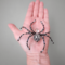 handcrafted decorative spider made from black, silver, and iridescent beads, designed as a unique ornament or collectible art piece.